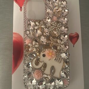 I phone 12 Pro protective cover.pink stones, white enamel flowers & elephant NWT